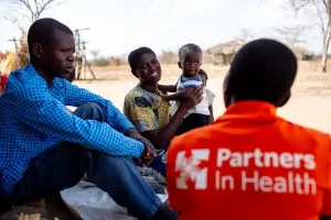 a community health worker with PIH/APZU, visits Evance Keneson.