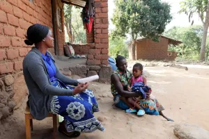 CHW visits client and her three children 