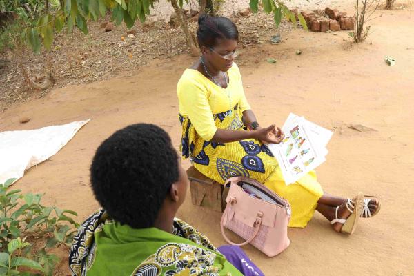 Mary Brown assisting a client with health education