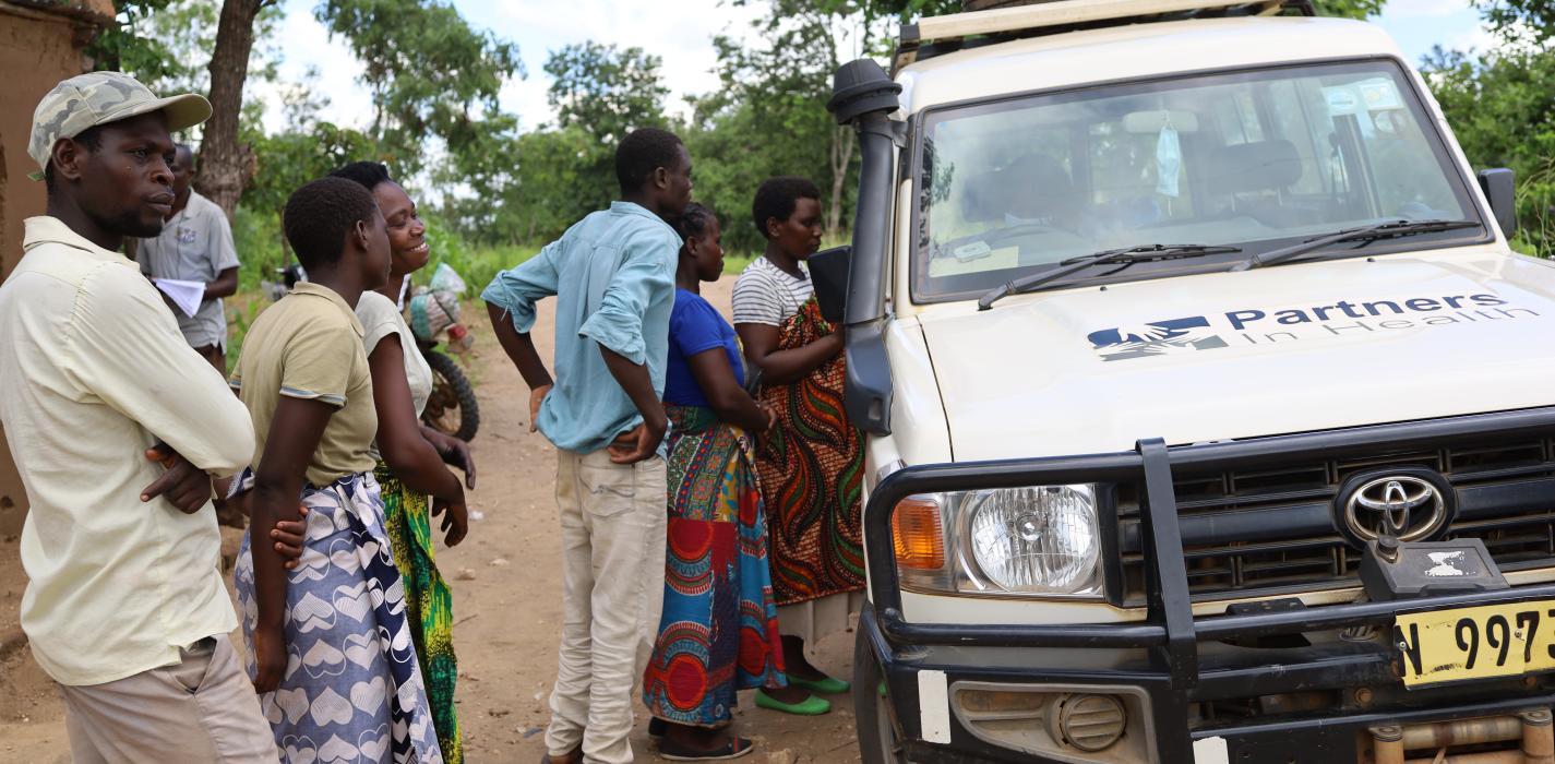 Partners In Health staff engage with Cyclone Ana beneficiaries.