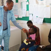 Health workers give two-dose oral regimen to a beneficiary