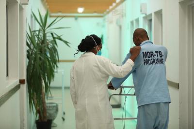 nurse in the MDR-TB ward, walks with patient