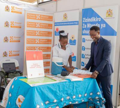 Mphande shares knowledge with a colleague on various topics including Maternal & Child Health care