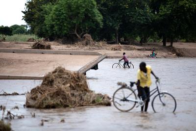 Chikwawa navigate around a bridge that collapsed into the Namikalango River during Cyclone Freddy.